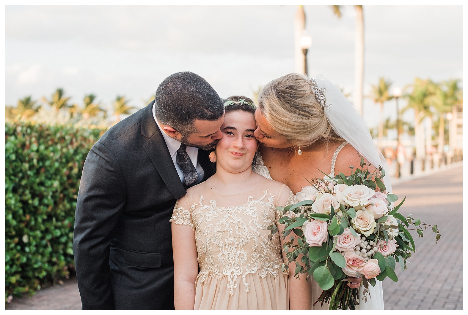 bride and groom kiss flower girl, bride and groom family, bride and groom blended family, blended family