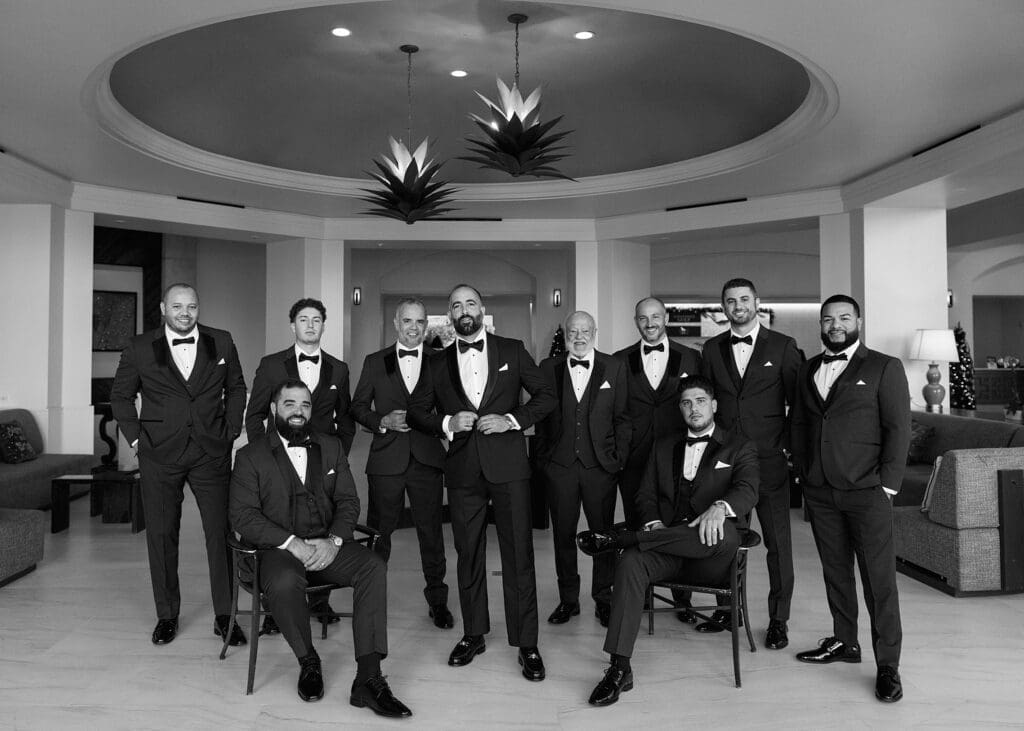 groom and groomsmen looking at the camera