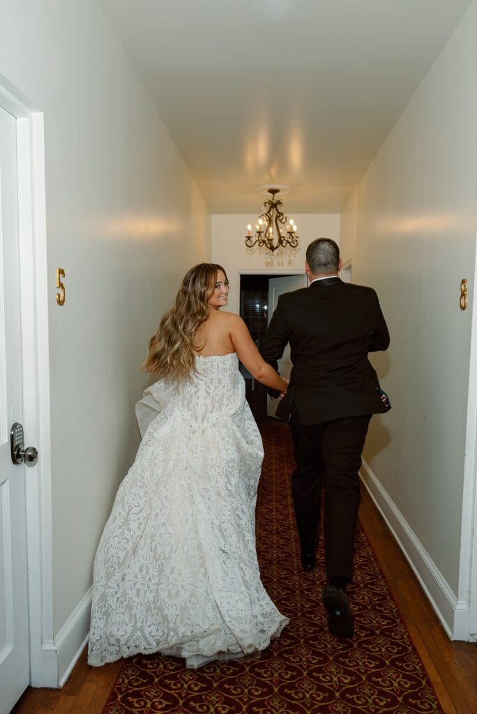 bride and groom running away