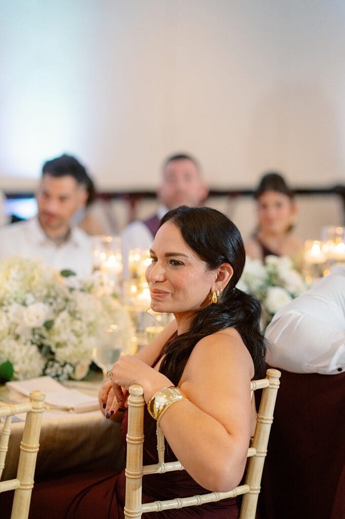 guest listening to the wedding speeches